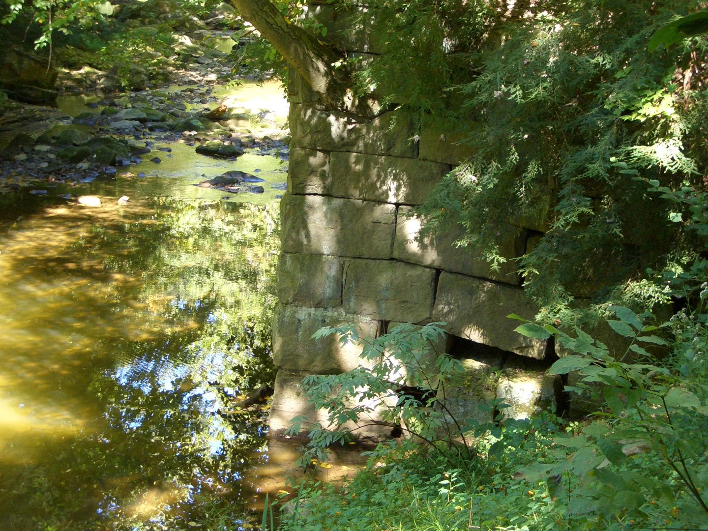 Former bridge abutment in Tomlinson Run State Park, photographed in 2007.